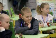 KHARKIV, UKRAINE - MAY 13, 2024 - A boy is pictured during a lesson at an underground school in Kharkiv, northeastern Ukraine. (Ukrinform/POLARIS