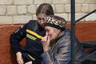 KHARKIV, UKRAINE - MAY 13, 2024 - An elderly woman stays by a psychologist of the State Emergency Service at a centre for people evacuated from Kharkiv region, Kharkiv, northeastern Ukraine. (Ukrinform/POLARIS