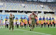 LVIV, UKRAINE - MAY 11, 2024 - Junior Sergeant of the 59th Yakiv Handziuk Separate Motorized Infantry Brigade Moisei Bondarenko and servicewoman of the 126th Separate Brigade of the Ukrainian Territorial Defence Forces Khrystyna Panasiuk perform the national anthem before the start of the 2023\/24 Ukrainian Premier League Matchday 28 game between FC Dynamo Kyiv and FC Shakhtar Donetsk at the Arena Lviv, Lviv, western Ukraine. The Miners have won the 2023\/24 Ukrainian Premier League title early with a seven-point gap and two rounds before the end of the championship due to the goal of Shakhtarâs midfielder Heorhii Sudakov in the 33rd minute. (Ukrinform\/POLARIS