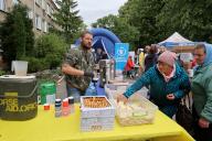 KHARKIV, UKRAINE - MAY 13, 2024 - A volunteer offers food at a centre for people evacuated from Kharkiv region, Kharkiv, northeastern Ukraine. (Ukrinform\/POLARIS
