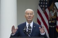 5/14/2024 - Washington, District of Columbia, United States of America: United States President Joe Biden, concerned about possible rainfall looks to the sky while making remarks on American Investments and Jobs at the White House in Washington, DC, May 14, 2024. (Chris Kleponis / CNP / Polaris
