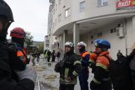 KHARKIV, UKRAINE - MAY 14, 2024 - Rescuers are seen outside a multi-story residential building damaged by Russian shelling, Kharkiv, northeastern Ukraine(Ukrinform/POLARIS