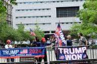 May 14, 2024 New York, NY - USA - Outside of the Trump hush money trial there is a small contingent of supporters who stay in the park throughout the day and then move around the corner to wave to the motorcade as it leaves the court area at the end of the day. (Photo: Andrea RENAULT/ Polaris Images