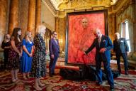 Image Licensed to i-Images / Polaris) Picture Agency. 14/05/2024. London, United Kingdom: King Charles III with artist Jonathan Yeo watched by Queen Camilla, at the unveiling of the artists new portrait of the King in the blue drawing room at Buckingham Palace in London. ( i-Images / Polaris) 