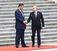 Working trip of Russian President Vladimir Putin to China. Russian President Vladimir Putin (right) and Chinese President Xi Jinping (left) during the official welcoming ceremony at the Great Hall of the People on Tiananmen Square. 16.05.2024 China, Beijing (Peking) (Dmitry Azarov\/Kommersant\/POLARIS
