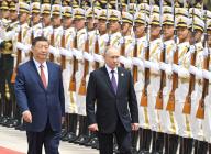 Working trip of Russian President Vladimir Putin to China. Russian President Vladimir Putin (right) and Chinese President Xi Jinping (left) during the official welcoming ceremony at the Great Hall of the People on Tiananmen Square. 16.05.2024 China, Beijing (Peking) (Dmitry Azarov\/Kommersant\/POLARIS