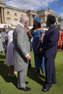 Image Licensed to i-Images / Polaris) Picture Agency. 15/05/2024. London, United Kingdom: King Charles III with Maya Jama and Campbell Addy at a Buckingham Palace Garden Party in London. ( i-Images / Polaris) 