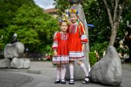 ZAPORIZHZHIA, UKRAINE - MAY 16, 2024 - Girls in flower wreaths and national costumes pose for a picture during the World Vyshyvanka Day celebration on Festyvalna Square, Zaporizhzhia, southeastern Ukraine. (UKRINFORM/POLARIS