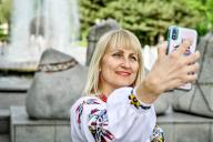 ZAPORIZHZHIA, UKRAINE - MAY 16, 2024 - A woman takes a selfie during the World Vyshyvanka Day celebration on Festyvalna Square, Zaporizhzhia, southeastern Ukraine. (UKRINFORM/POLARIS