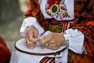 ZAPORIZHZHIA, UKRAINE - MAY 16, 2024 - A woman teaches a girl to embroider during the World Vyshyvanka Day celebration on Festyvalna Square, Zaporizhzhia, southeastern Ukraine. (UKRINFORM/POLARIS