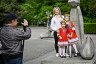 ZAPORIZHZHIA, UKRAINE - MAY 16, 2024 - A woman with two girls pose for a picture during the World Vyshyvanka Day celebration on Festyvalna Square, Zaporizhzhia, southeastern Ukraine. (UKRINFORM/POLARIS