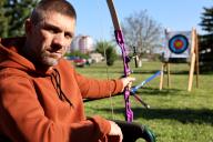 IVANO-FRANKIVSK, UKRAINE - MAY 16, 2024 - A serviceman who is being treated for his wounds attends an archery masterclass given by Kateryna Dubrovina, a Ukrainian archer who won a silver medal in the team competition at the 2000 Summer Olympics, Ivano-Frankivsk, western Ukraine. (Ukrinform/POLARIS