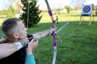 IVANO-FRANKIVSK, UKRAINE - MAY 16, 2024 - A serviceman who is being treated for his wounds attends an archery masterclass given by Kateryna Dubrovina, a Ukrainian archer who won a silver medal in the team competition at the 2000 Summer Olympics, Ivano-Frankivsk, western Ukraine. (Ukrinform/POLARIS