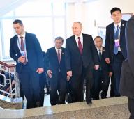 Working trip of Russian President Vladimir Putin to China. Russian President Vladimir Putin (center) and Chairman of the Council of Harbin Polytechnic University Xiong Sihao (second from left) before a meeting with students and teachers of Harbin Polytechnic University. 17.05.2024 China, Harbin (Dmitry Azarov/Kommersant/POLARIS