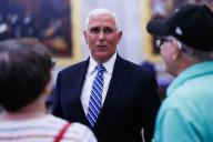 May 16, 2024 - Washington, DC, United States: Former US Vice President Mike Pence speaks with tourists in the Rotunda of the US Capitol in Washington DC, after attending a ceremony celebrating the unveiling of a statue of the late Reverend Billy Graham, on Thursday, May 16, 2024. (Aaron Schwartz / CNP / Polaris