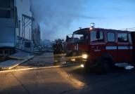 ODESA, UKRAINE - MAY 17, 2024 - Rescuers work at a civil enterprise damaged by a Russian missile attack, Odesa, southern Ukraine. firefighter, fire engine (Ukrinform/POLARIS