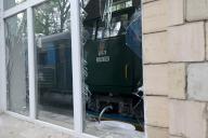 KHARKIV, UKRAINE - MAY 19, 2024 - A train at the Junior Southern Railway, a childrenâs railway, damaged by Russian shelling is reflected in the shards of a broken window, Kharkiv, northeastern Ukraine. (UKRINFORM/POLARIS