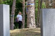 KYIV, UKRAINE - MAY 19, 2024 - A woman visits the Bykivnia Graves National Historical and Memorial Reserve on the Day of Remembrance of the Victims of Political Repressions, Kyiv, capital of Ukraine. (UKRINFORM/POLARIS