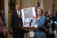 5/21/2024 - Washington, District of Columbia, United States of America: United States Senator Shelley Moore Capito (Republican of West Virginia) holds up a photo as she speaks at a weekly post-luncheon press conference in the US Capitol in Washington, D.C. on Tuesday, May 21, 2024. (Annabelle Gordon / CNP / Polaris