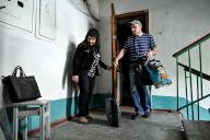 STEPNOHIRSK, UKRAINE - MAY 21, 2024 - A man and woman leave an apartment in a block of flats opposite the settlement council building which a Russian guided bomb has hit during the evacuation, Stepnohirsk, Zaporizhzhia region, southeastern Ukraine.(Ukrinform/POLARIS