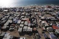 A general view is showing tents housing internally displaced Palestinians crowding the beach and the Mediterranean shoreline in Deir el-Balah in the central Gaza Strip on June 02, 2024, amid the ongoing Israel war in Gaza. (Omar Ashtawy apaimages/APAImages/Polaris