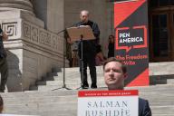 New York, New York - AUGUST 19: American writer and film director Paul Auster reads a passage from author Salman Rushdie