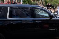Donald Trump waves to supporters from his motorcade while leaving the Manhattan Criminal Courthouse after learning of the former president