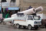QUETTA, PAKISTAN, APR 26: Laborers are busy in unloading Iranian Carpets from vehicle to earn their livelihood for support their families, at Double road in Quetta on Friday, April 26, 2024. (Sami Khan\/PPI Images