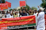PESHAWAR, PAKISTAN, MAY 01: Members of Peoples Labour Bureau are holding protest demonstration as they are presenting tribute to martyrs of Chicago on the occasion of International Labour Day, at Peshawar press club on Wednesday, May 1, 2024. (Fahad Pervez\/PPI Images