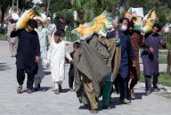 PESHAWAR, PAKISTAN, MAY 05: Flood-affected people are returning after receiving relief food packages donated by Punjab Chief Minister Maryam Nawaz on the request of Mayor Peshawar Zubair Ali, in Peshawar on Sunday, May 5, 2024. (Fahad Pervez\/PPI Images