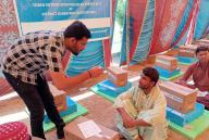 NASEERABAD, PAKISTAN, MAY 05: Volunteers are distributing solar kits among flood affected victims during Solar Energy Kits Distribution ceremony arranged by United Nations High Commissioner for Refugees (UNHCR), held in Naseerabad on Sunday, May 5, 2024. (Rehmatullah Pechuho\/PPI Images