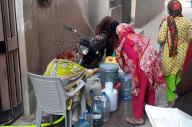 KARACHI, PAKISTAN, MAY 08: People are filling their water cans from public tap as they facing shortage of drinking water in their area, at Malir area in Karachi on Wednesday, May 8, 2024. (S.Imran Ali\/PPI Images