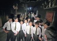 PESHAWAR, PAKISTAN, MAY 09: Students from Army Public School (APS) visit Radio Pakistan building which was torched last year in the wake of May 9 riots, in Peshawar on Thursday, May 9, 2024. The government has decided to mark May 9 as black day on Thursday (today) in commemoration of the first anniversary of the violence against military installations throughout the country. (Fahad Pervez\/PPI Images