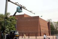 LAHORE, PAKISTAN, MAY 17: Technicians are busy in repairing of CCTV cameras to resume issuing e-challans over violations of traffic rules, at Mall road in Lahore on Friday, May 17, 2024. (Babar Shah/PPI Images