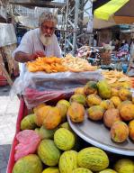 SUKKUR, PAKISTAN, MAY 17: Vendor sells melons and papaya to earn his livelihood for support his family, on his pushcart at a roadside in Sukkur on Friday, May 17, 2024. (Shahid Ali/PPI Images