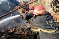 MULTAN, PAKISTAN, MAY 18: Fire fighters extinguishing fire during rescue operation after fire broke out incident, at Wood Market in Multan on Saturday, May 18, 2024. (Abdul Sattar/PPI Images