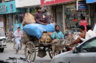QUETTA, PAKISTAN, MAY 19: Donkey-cart riders carry goods passing towards their destination to earn their livelihood for support their family, at Jinnah road in Quetta on Sunday, May 19, 2024. (Sami Khan/PPI Images