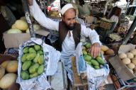 PESHAWAR, PAKISTAN, MAY 19: A vendor sells mangoes to earn his livelihood for support of his family, as the demand increased on the arrival of Mango season during hot summer season, at a roadside stalls located on fruit market in Peshawar on Sunday, May 19, 2024. (Fahad Pervez/PPI Images