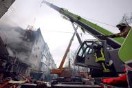 SUMY, UKRAINE - MARCH 13, 2023 - Rescuers use high-altitude equipment and special tools to searching for people under the rubble of a five-story residential building destroyed by one of the Shahed drones launched by Russian troops to attack Sumy, 