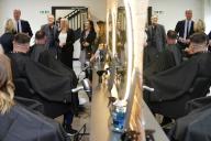 Britain\'s Prince William, the Prince of Wales, is reflected in a mirror as he visits the hairdresser during the official opening of a new employment skills training and community outreach centre for Betel UK, a charity for people affected by