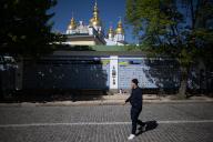 09 May 2024, Ukraine, Kiew: A man walks past the wall of remembrance of those who died for Ukraine at St. Michael\'s Monastery. The Federal Minister for Economic Cooperation and Development is currently in Ukraine. The trip is in preparation for the
