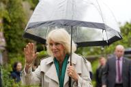 Britain\'s Queen Camilla waves as she leaves after a surprise appearance at the opening session of the Charleston Festival in Charleston, England, Thursday, May 16, 2024. The Queen joins this year\'s opening event called the \'Power of Reading\', aiming