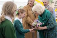 Britain\'s Queen Camilla receives flowers as she makes a surprise appearance at the opening session of the Charleston Festival in Charleston, England, Thursday, May 16, 2024. The Queen joins this year\'s opening event called the \'Power of Reading\',