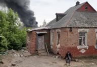 KHARKIV, UKRAINE - MAY 17, 2024 - A pillar of smoke rises from behind a house following the shelling of Russian troops, Kharkiv, northeastern Ukraine., Credit:Vyacheslav Madiyevskyy / Avalon