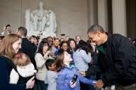 President Barack Obama greets tourists at the Lincoln Memorial in Washington, D.C., Saturday, April 9, 2011. The President made an unannounced stop to thank people for visiting the memorial a day after he and Congressional leaders agreed on a bill ...