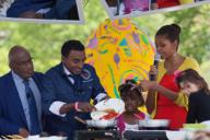 First Lady Michelle Obama and two young girls participate in a healthy cooking demonstration with Al Roker, left, and guest chef Marcus Samuelsson during the 2012 White House Easter Egg Roll on the South Lawn, April 9, 2012. The group prepared ...