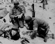 Medics helping injured soldier France 1944. (Edisto Images)
