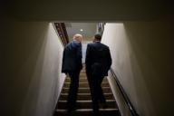 President Barack Obama and Vice President Joe Biden talk as they walk up a staircase in the West Wing of the White House, April 3, 2012.