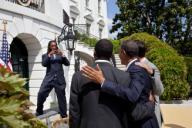 Quarterback Phillip Sims takes a picture of President Barack Obama as he poses for a photo with members of the BCS National Champion University of Alabama Crimson Tide football team following a ceremony to honor their 14th national championship and ...
