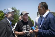 UNITED STATES - May 20: Ben Cohen, left, Jerry Greenfield, Founders of Ben & Jerryâs, talk with civil rights activist Jesse Jackson at an event on police reform and ending qualified immunity outside of the U.S. Supreme Court in Washington on Thursday, May 20, 2021. (Photo by Caroline Brehman/CQ Roll Call